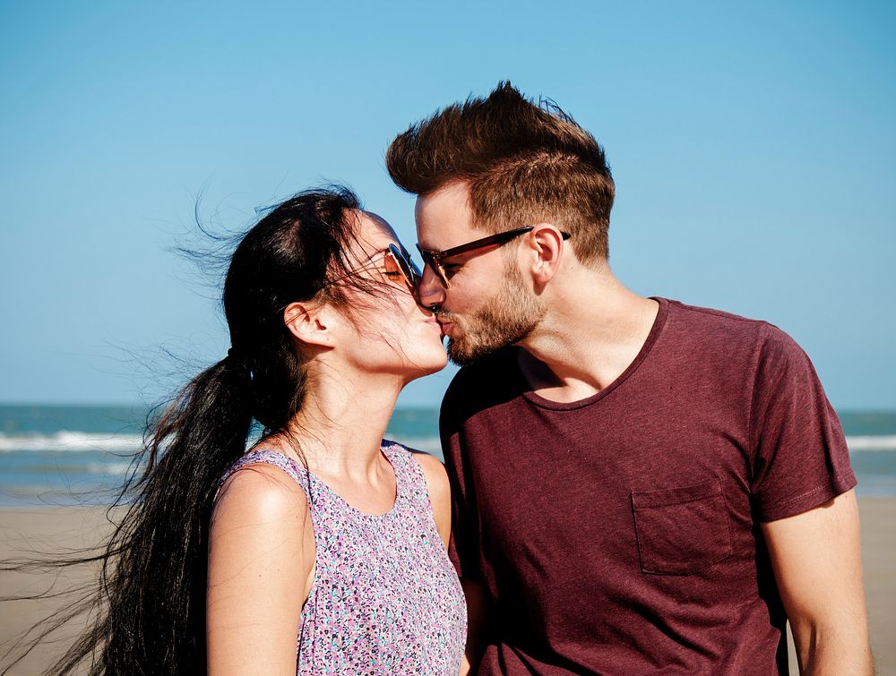 Young couple kissing at the beach