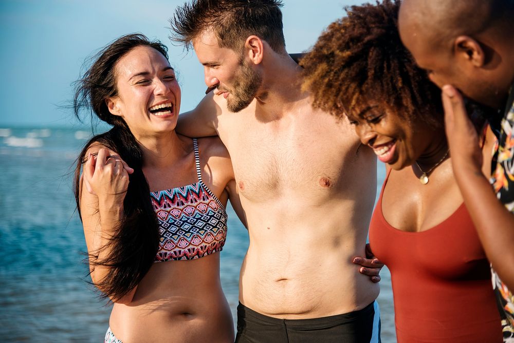 Group of cheerful friends at the beach
