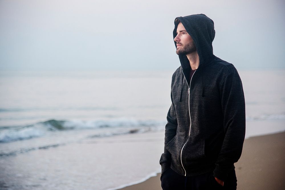 Man walking in solitude at the beach