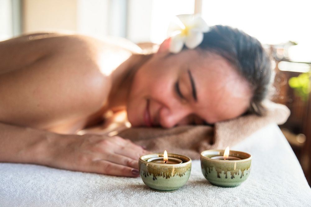 Woman enjoying a relaxing massage at a spa
