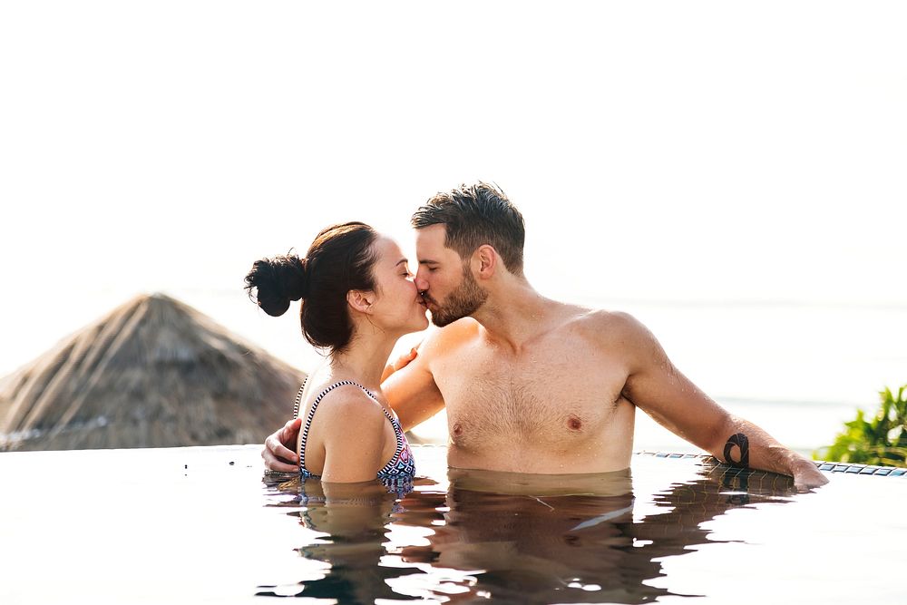 Couple kissing in a pool