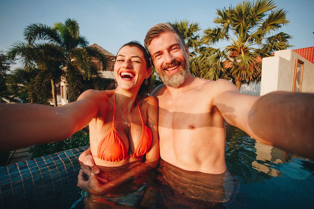 Couple taking a selfie in a pool