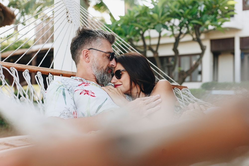 Couple resting together in a hammock