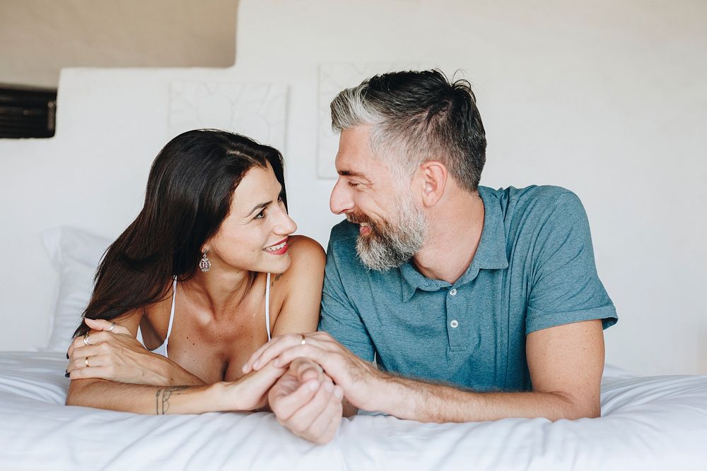 Couple spending their honeymoon in bed