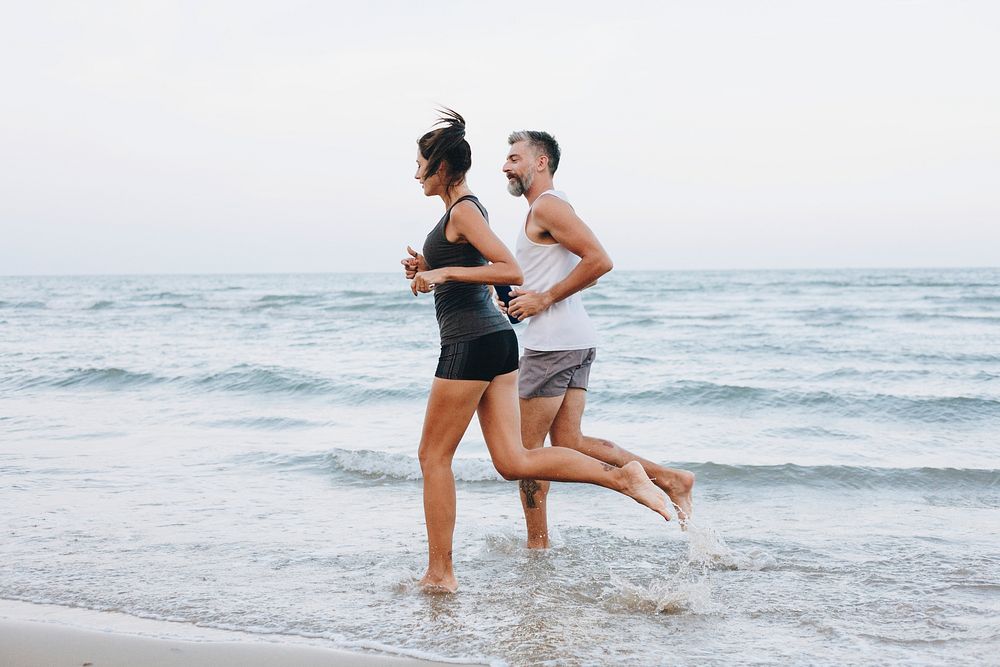 Couple jogging on a beach