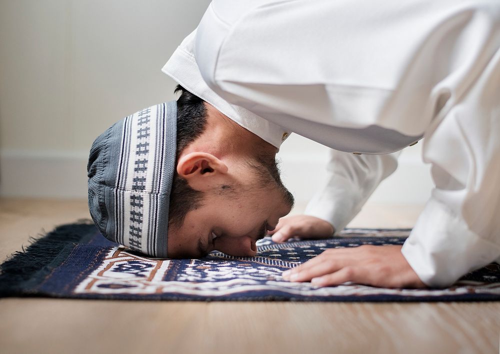 Muslim boy praying in Sujud posture