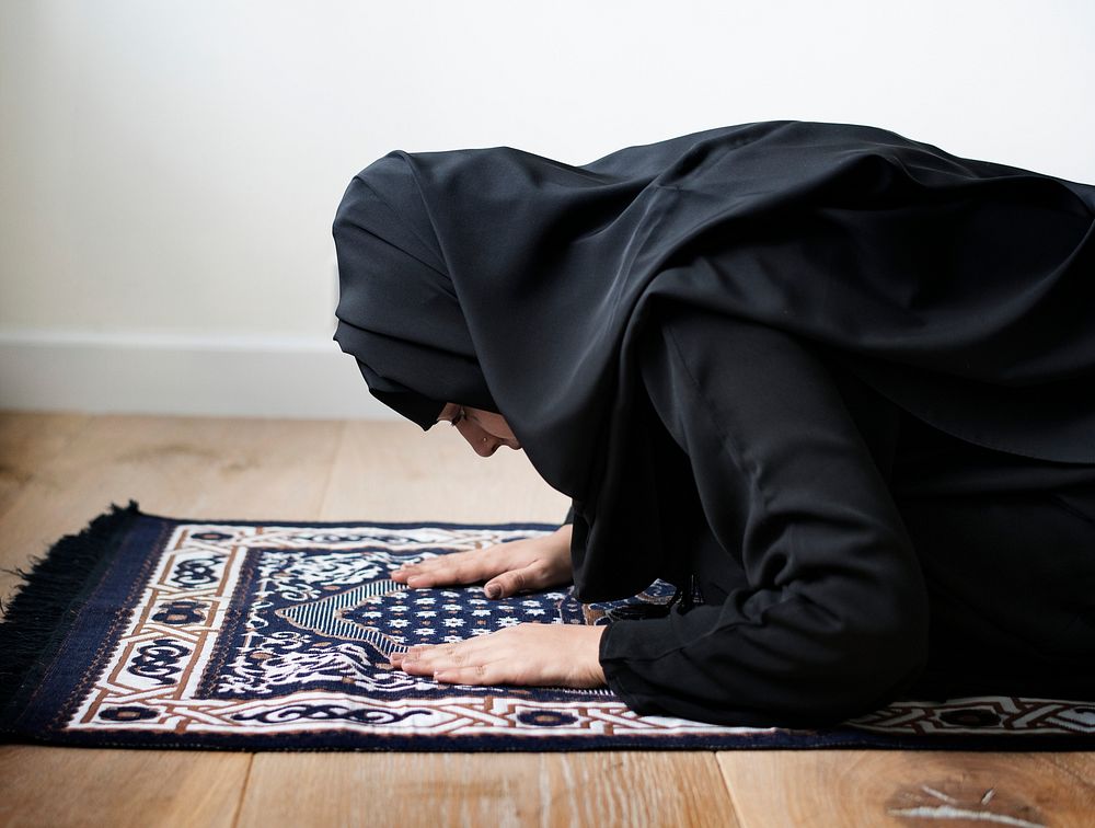 Muslim woman praying in Sujud posture