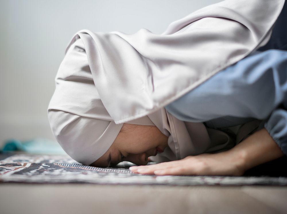 Muslim woman praying in Sujud posture