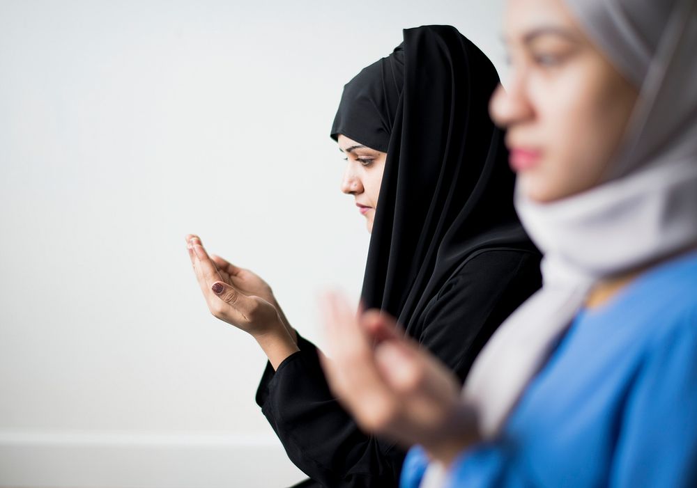 Muslim women making Dua to Allah