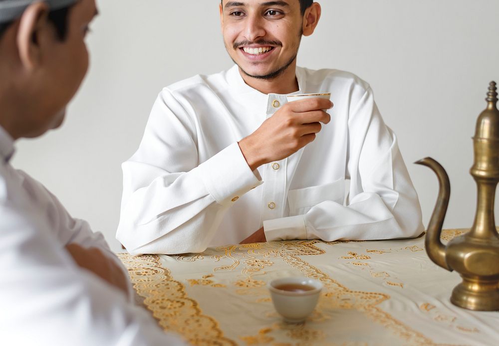 Muslim men having a cup of tea