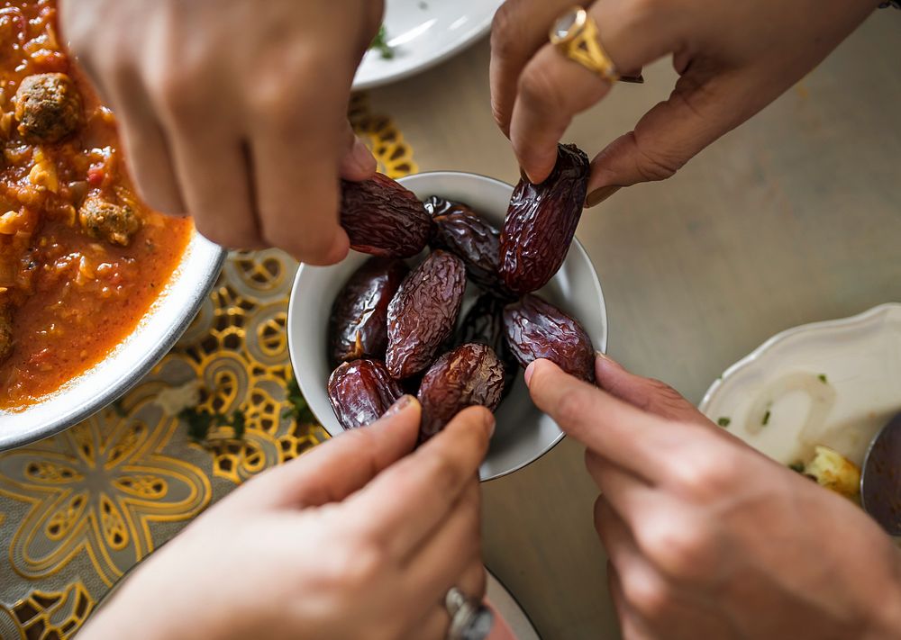Family sharing a bowl of dates