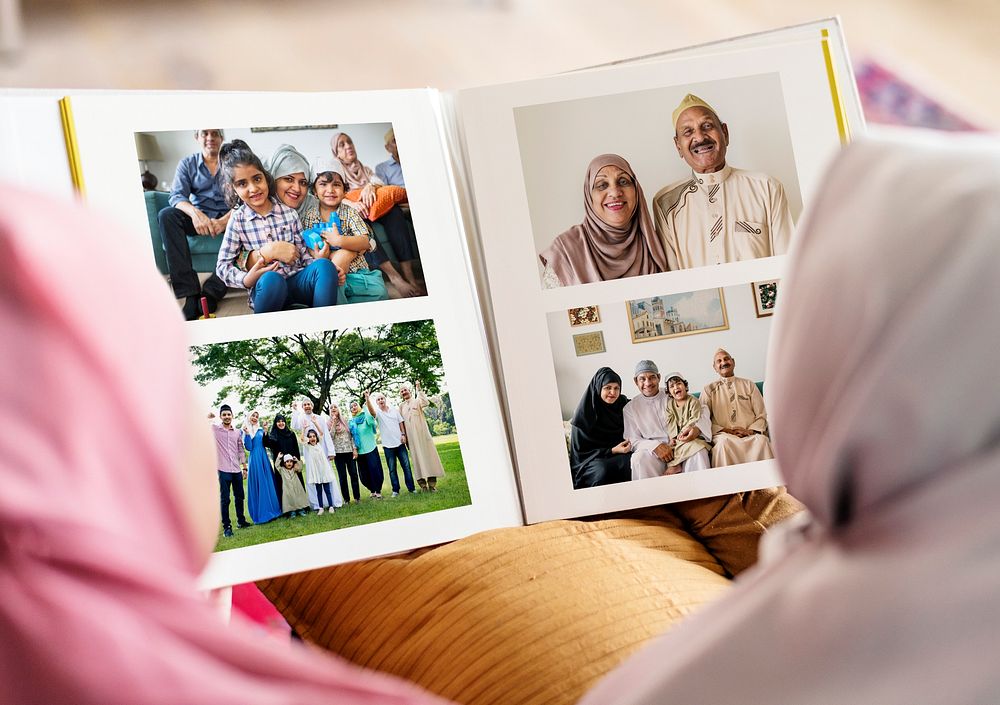 Muslim family looking in a photo album