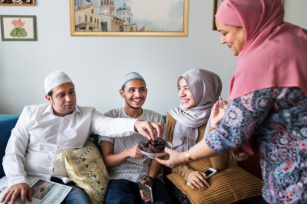 Muslim family having dried dates as a snack