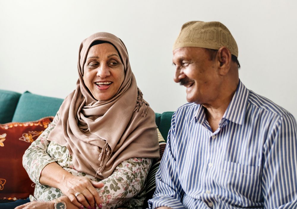 Happy Middle Eastern mature couple at home
