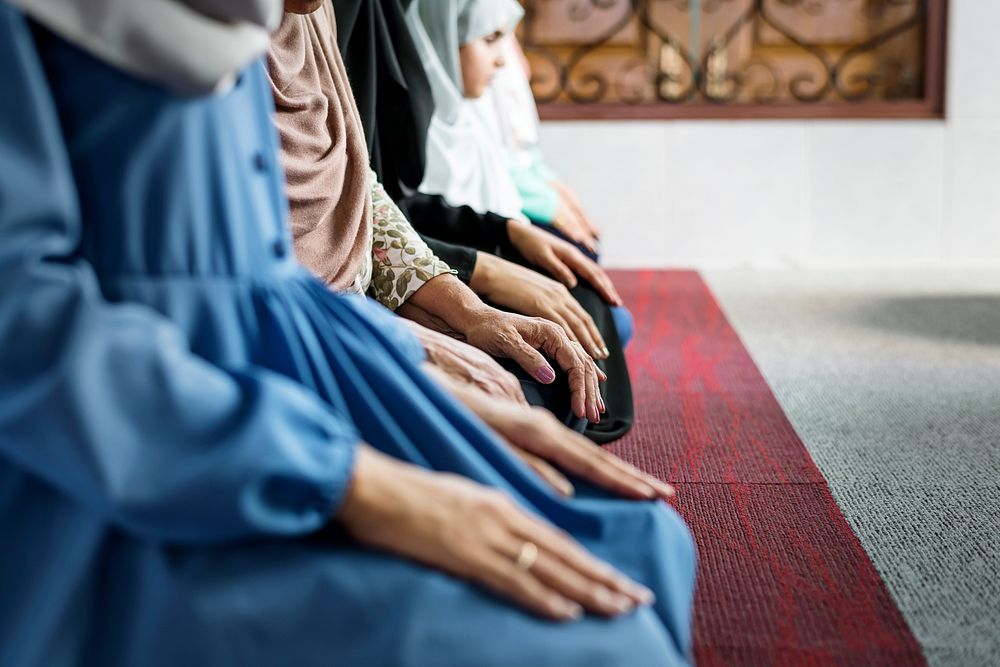 Muslim women meditating in the mosque during Ramadan