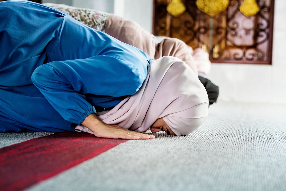 Muslim people praying in Sujud posture