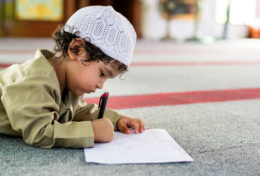 Muslim boy learning in a mosque