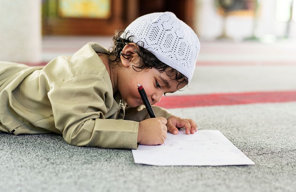 Muslim boy learning in a mosque
