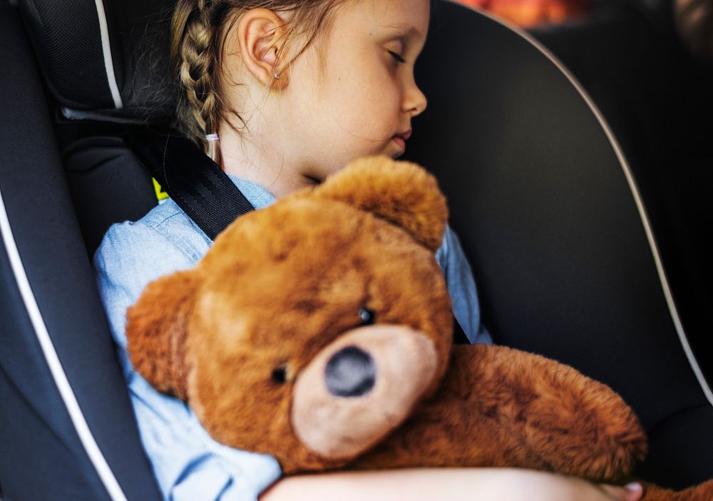 Little girl sleeping in the car