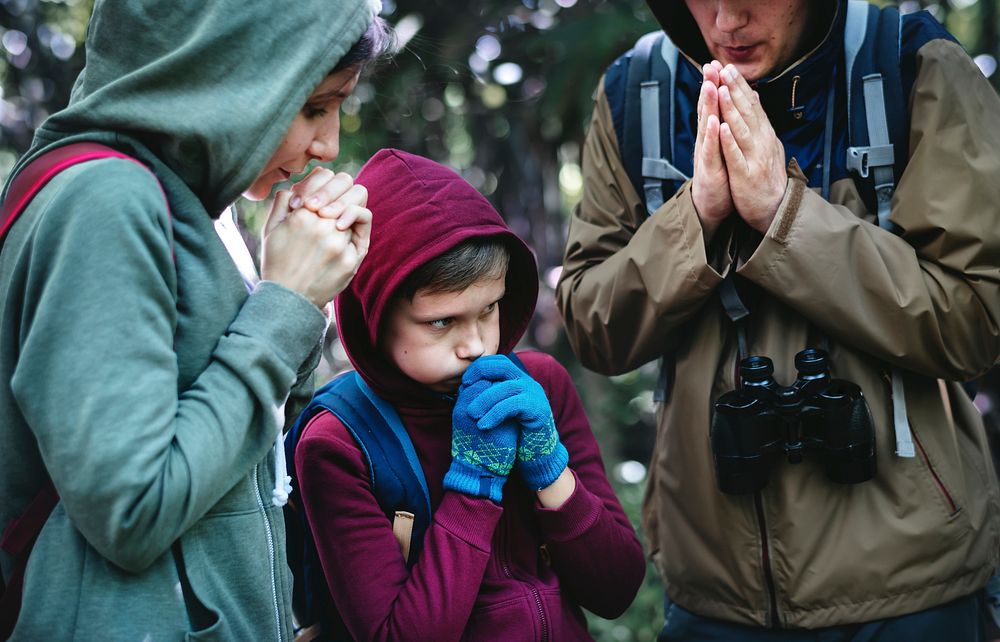 Family lost and cold in a forest