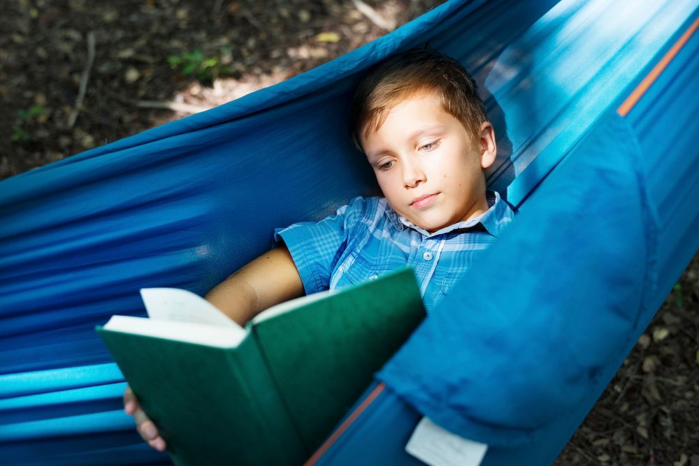 Boy reading in the hammock