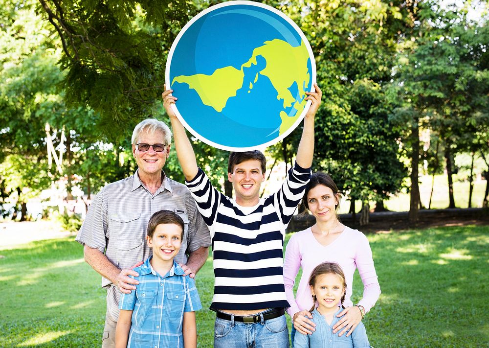 Happy family holding up the globe