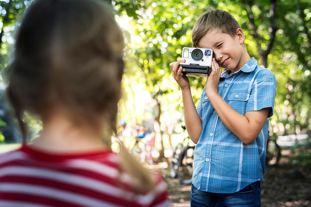 Boy using a vintage camera