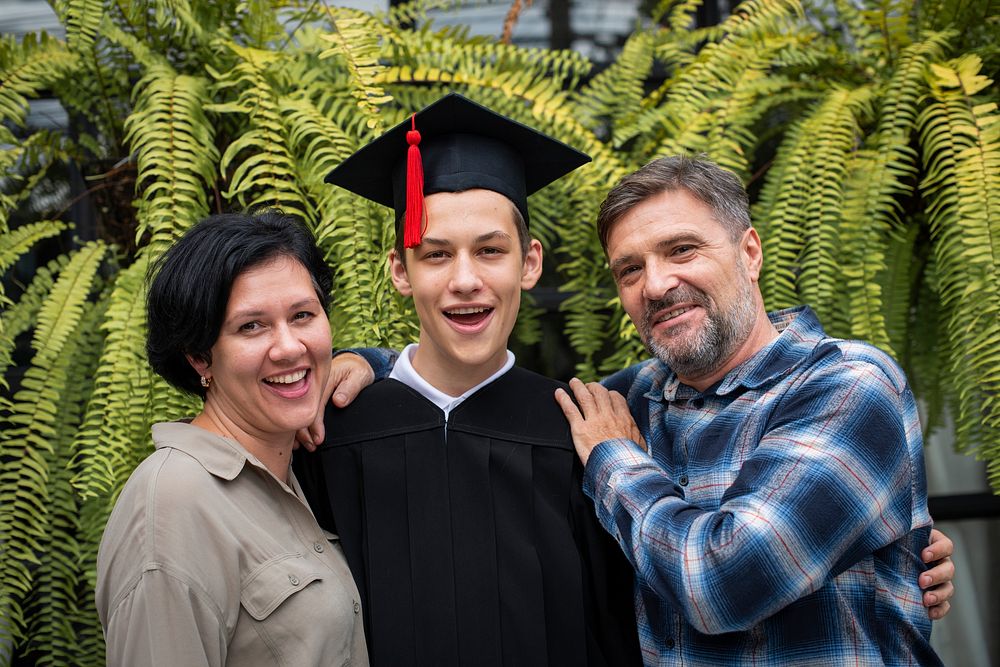 Teen graduate with his family
