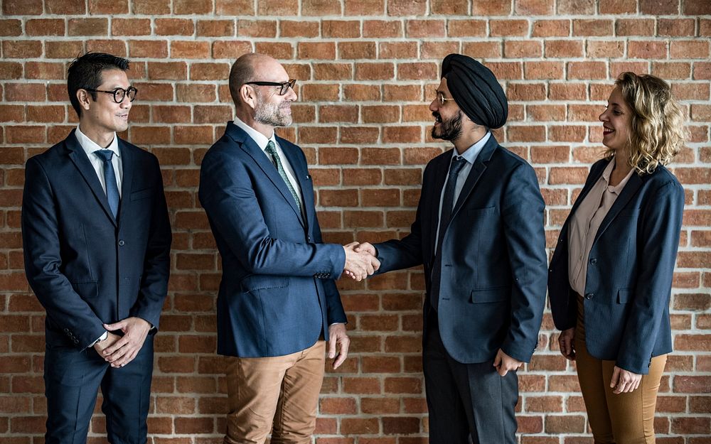 Group of corporate businessman shaking hands