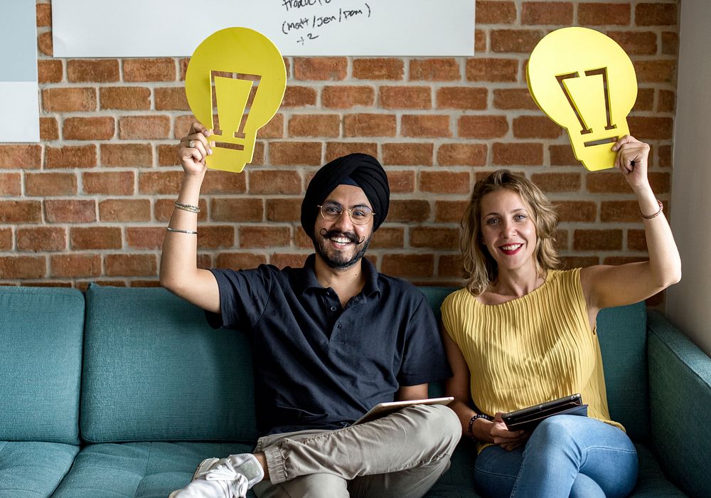 Startup business people holding an innovation concept symbol