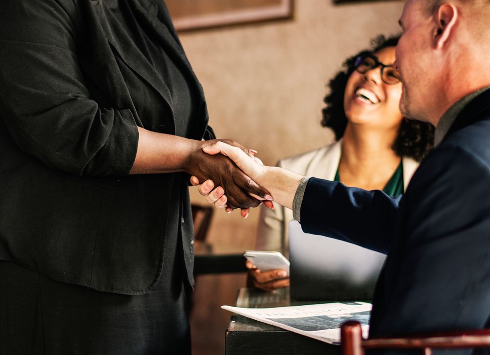 Man shaking hands with the lady