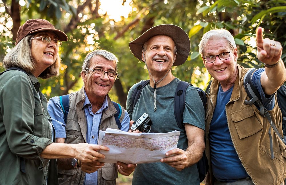 Mature campers checking for direction