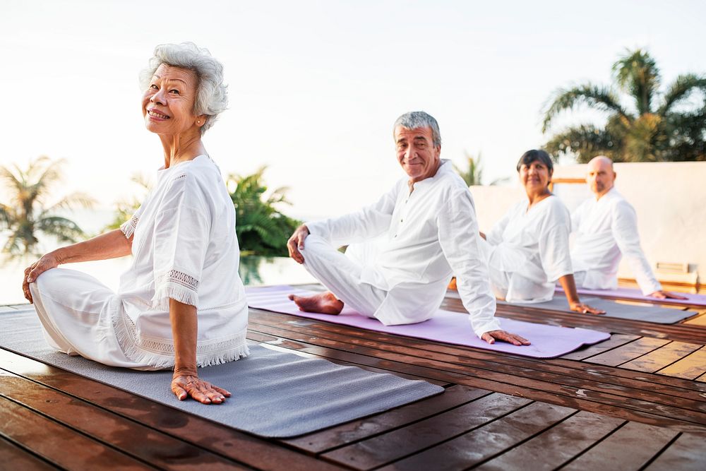 Group of seniors practicing yoga