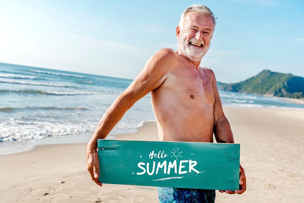 Senior man holding a plank with Hello Summer