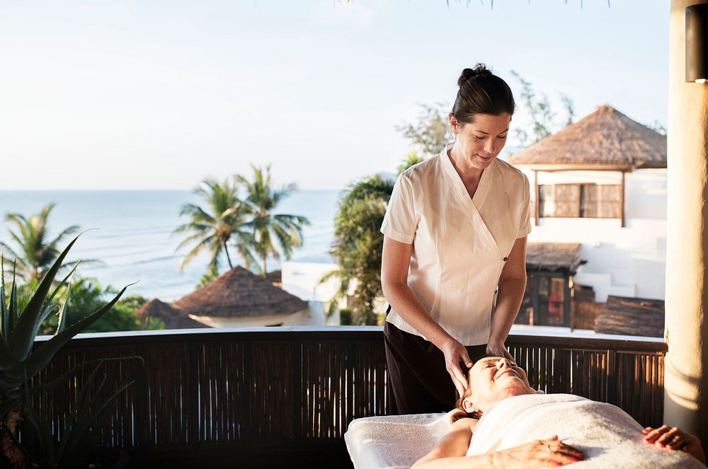 Massage therapist massaging at a spa