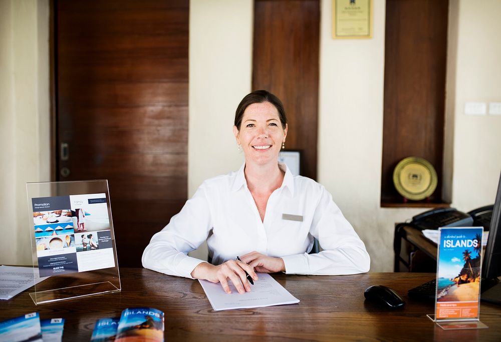 Female receptionist working at the front desk