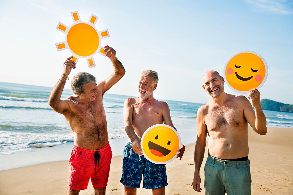 Senior men having fun on the beach