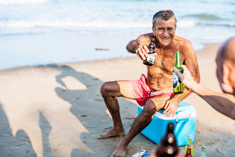 Senior friends hanging out on the beach