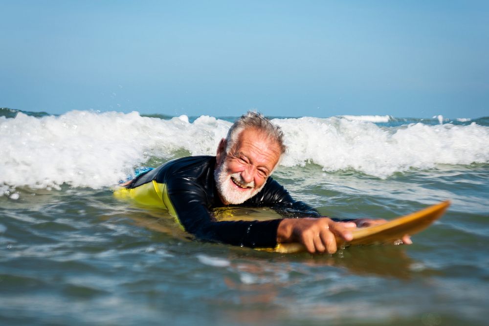 Mature surfer ready to catch a wave