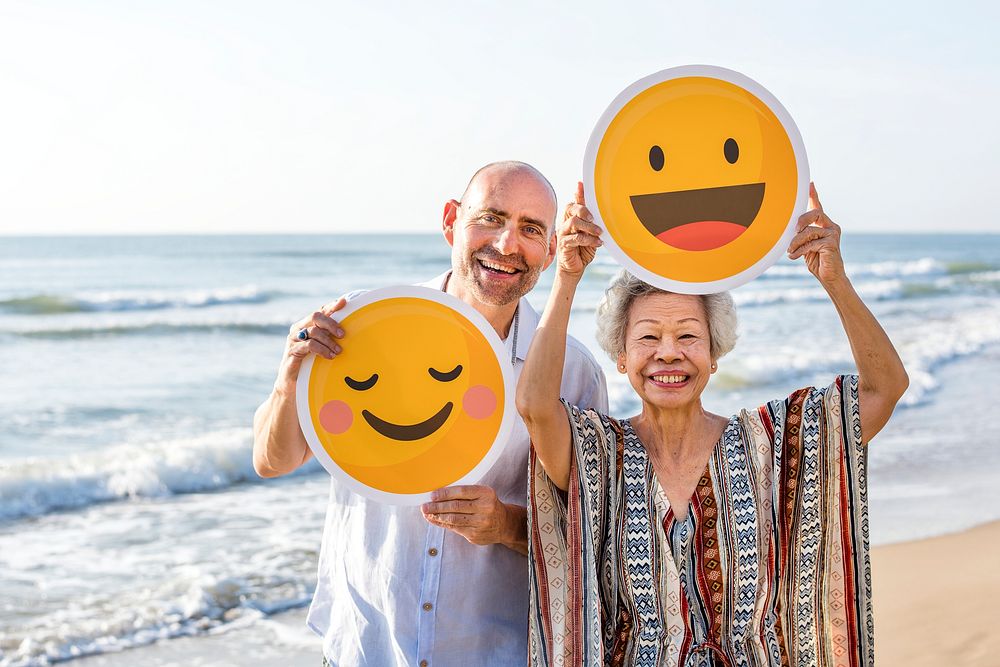 Happy mature mother and son at the beach