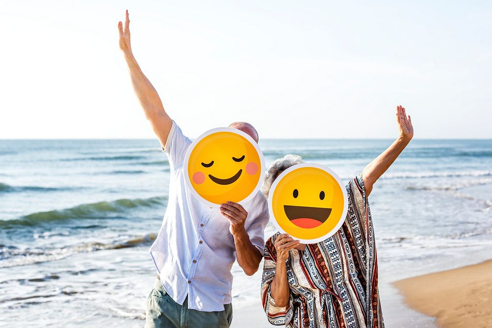Happy mature mother and son at the beach