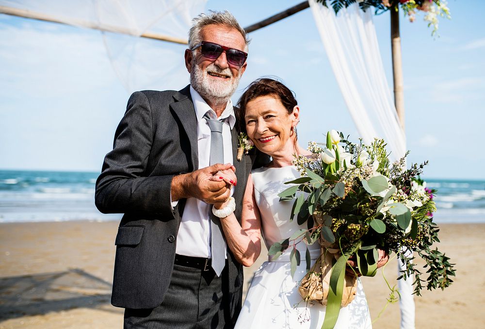 Mature couple getting married at the beach