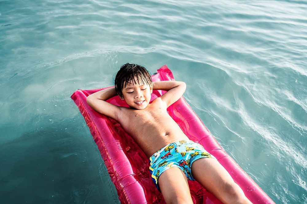 Young Asian boy in a swimming pool