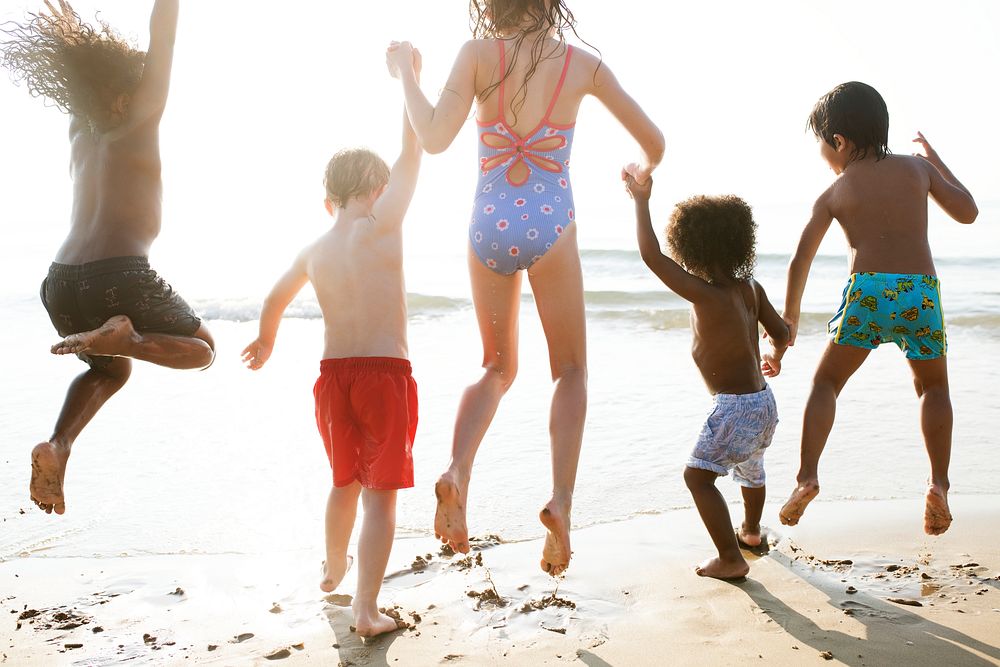 Group of kids enjoying their time at the beach