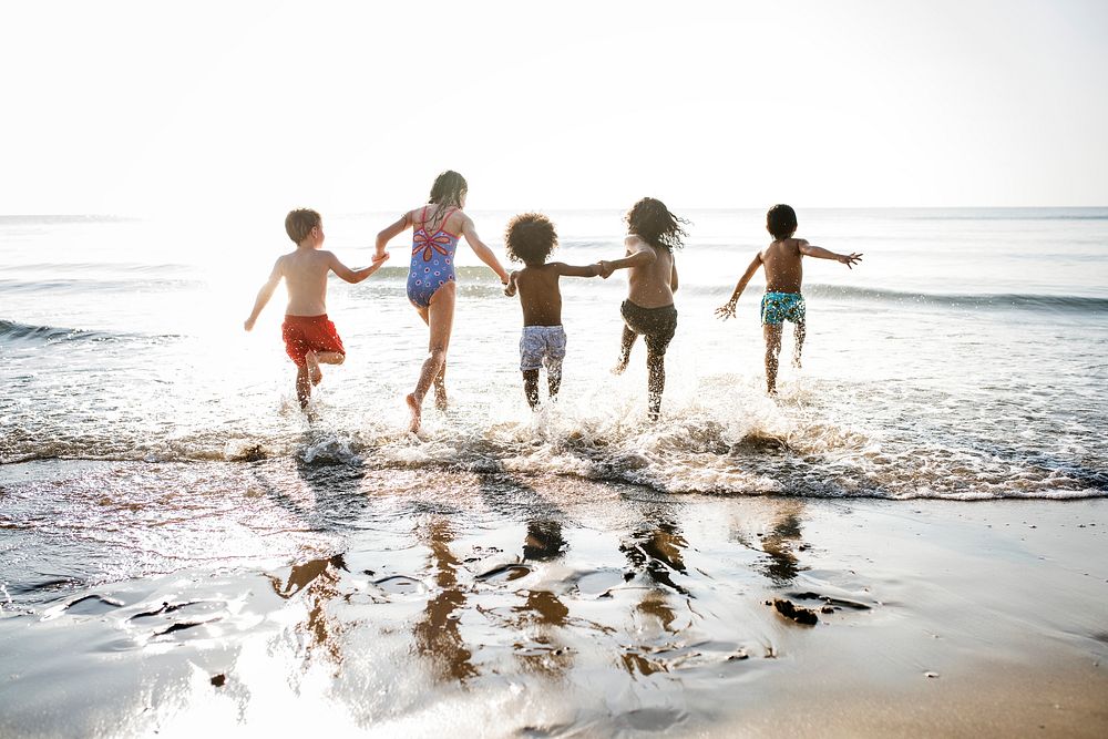Kids running at the beach
