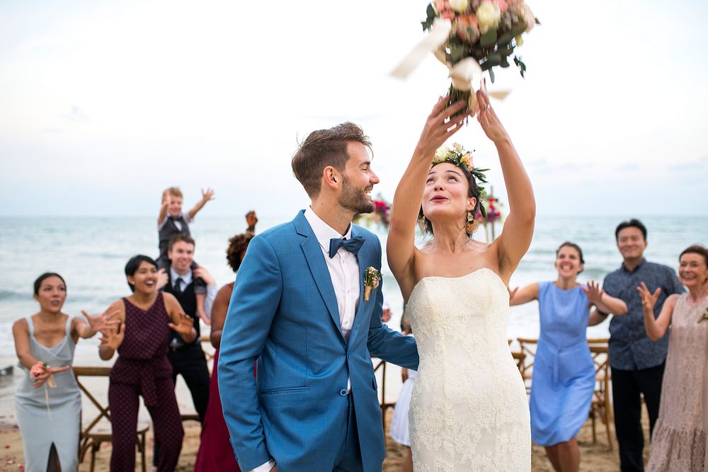 Young couple in a wedding ceremony at the beach