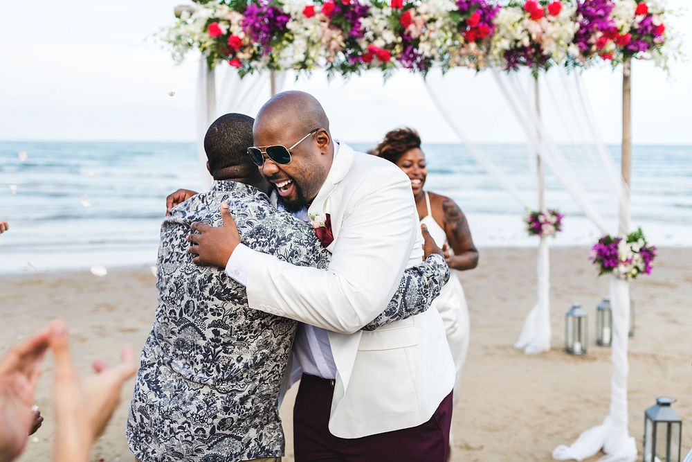 African American couple getting married at the beach