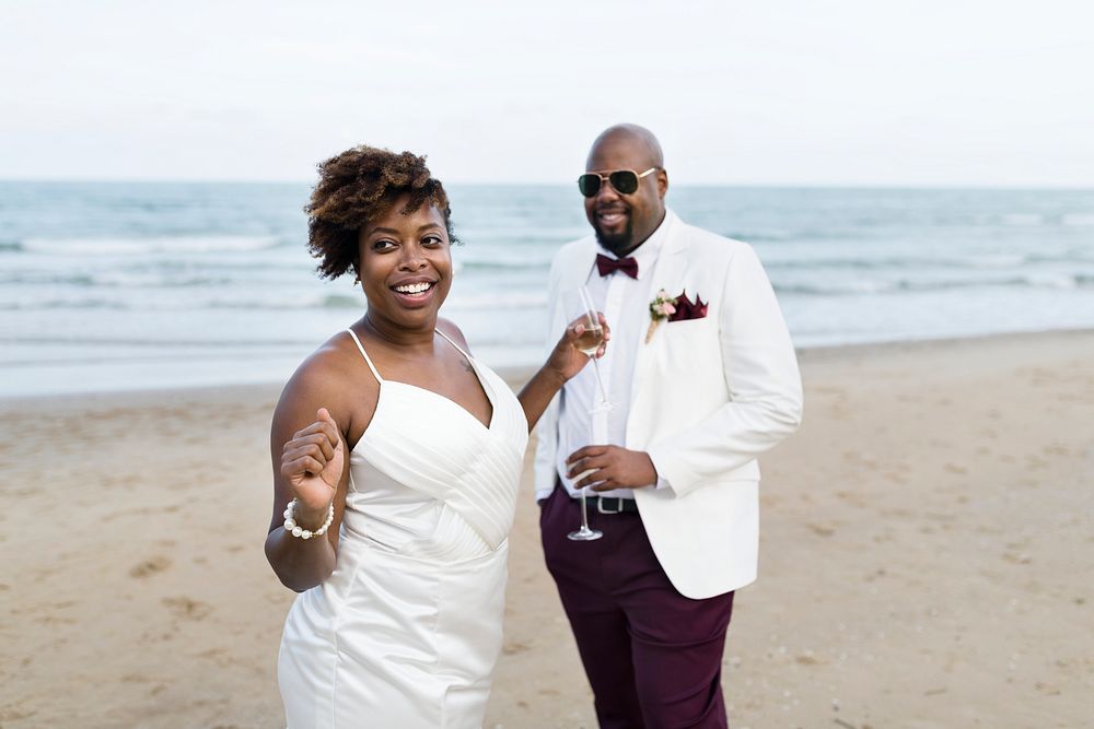 Newlyweds enjoying their wedding reception on the beach