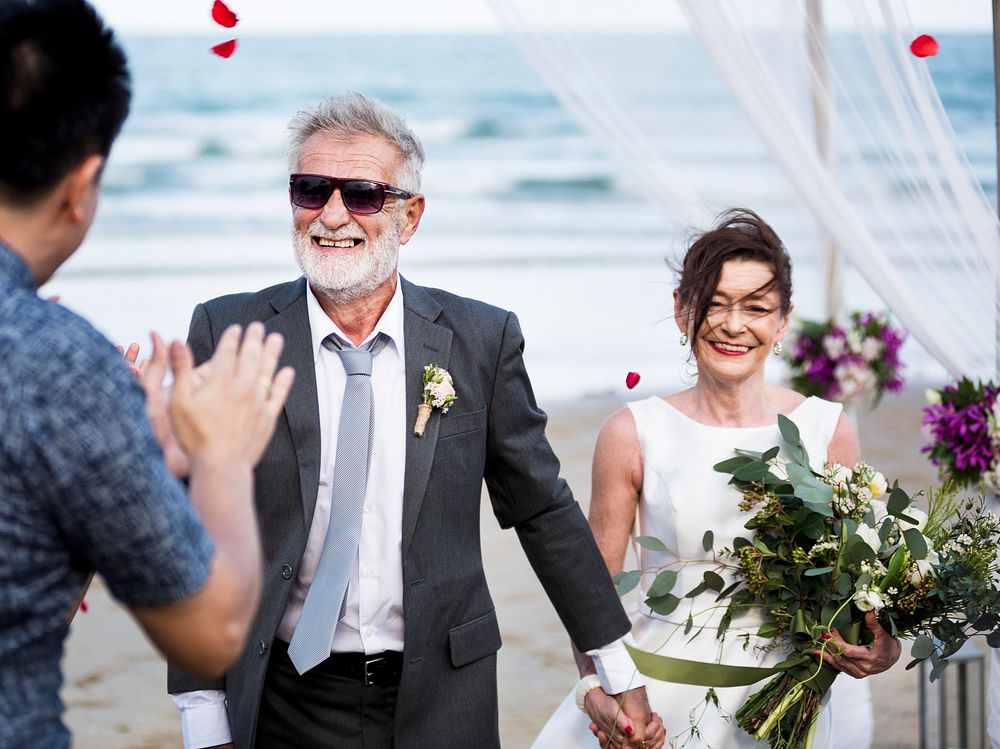 Senior couple getting married at the beach