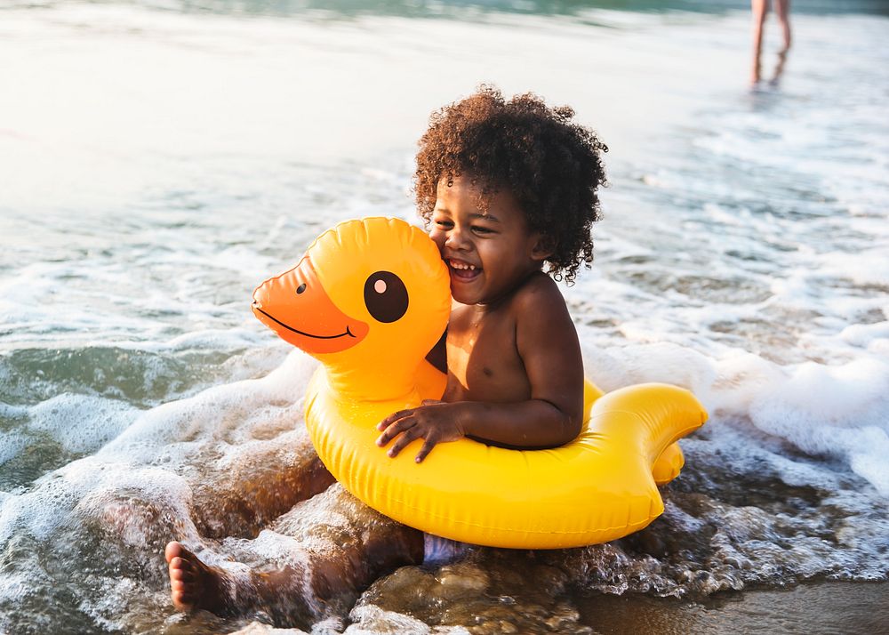 African little boy playing at the beach